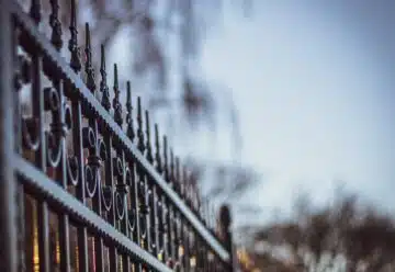 black metal fence during daytime