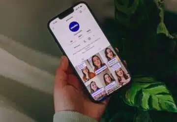 a person holding a cell phone in their hand