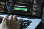 person using MacBook pro turned on